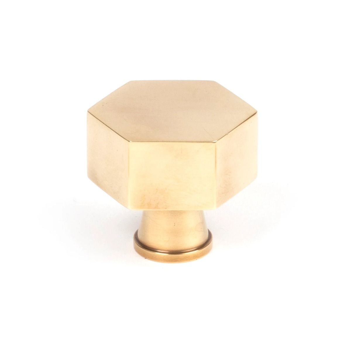 The 32mm "Vanguard" Hexagonal Cabinet Knob in Aged Brass on a White Background Shown Upright