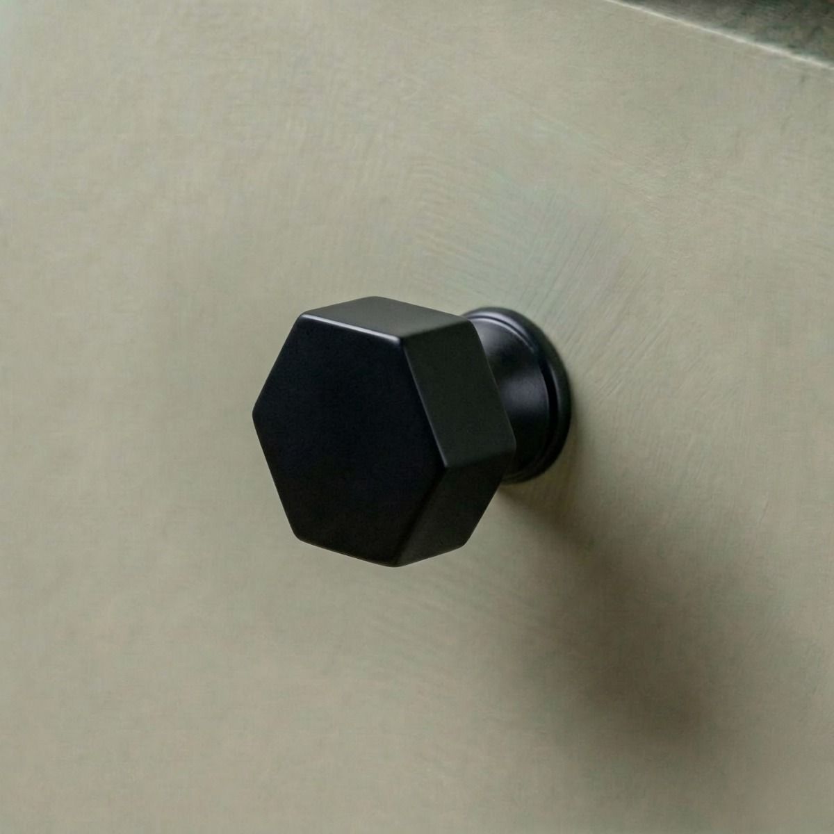 The 32mm "Vanguard" Hexagonal Cabinet Knob in Matt Black Mounted on a Kitchen Cupboard Drawer - Digital Illustration 