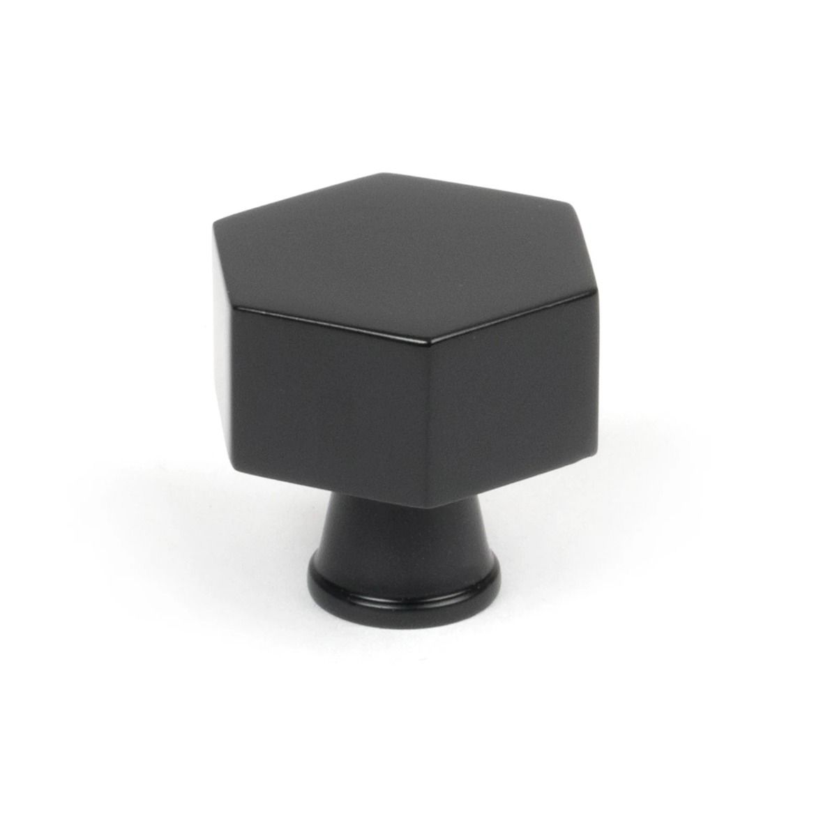 The 32mm "Vanguard" Hexagonal Cabinet Knob in Matt Black on a White Background Shown Stood Upright