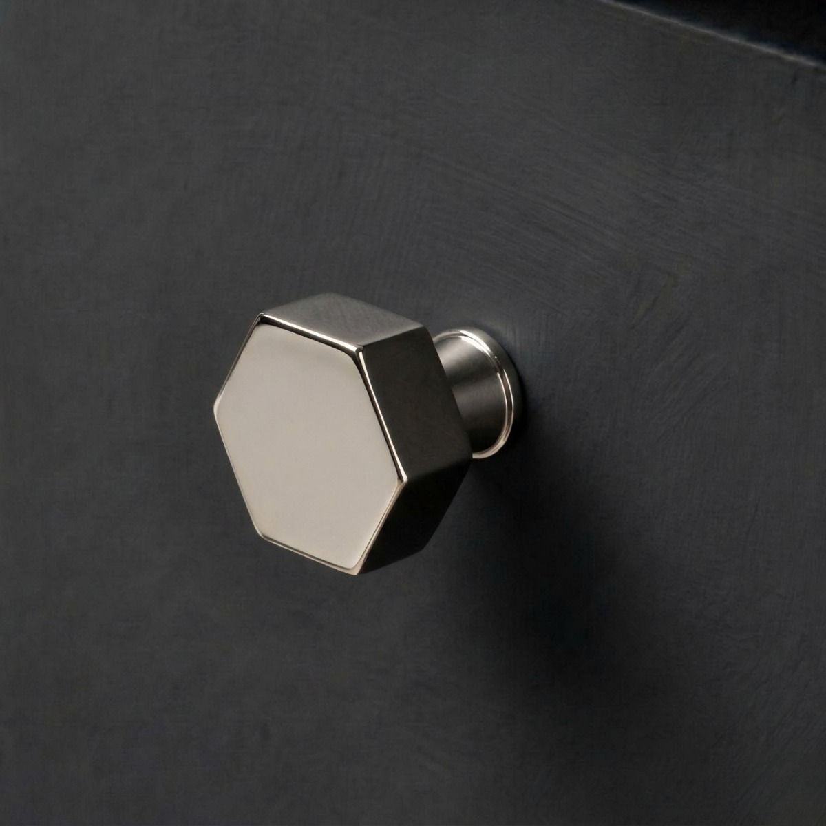 The 32mm "Vanguard" Hexagonal Cabinet Knob in Polished Nickel Mounted on a Charcoal Coloured Kitchen Drawer - Digital Illustration 