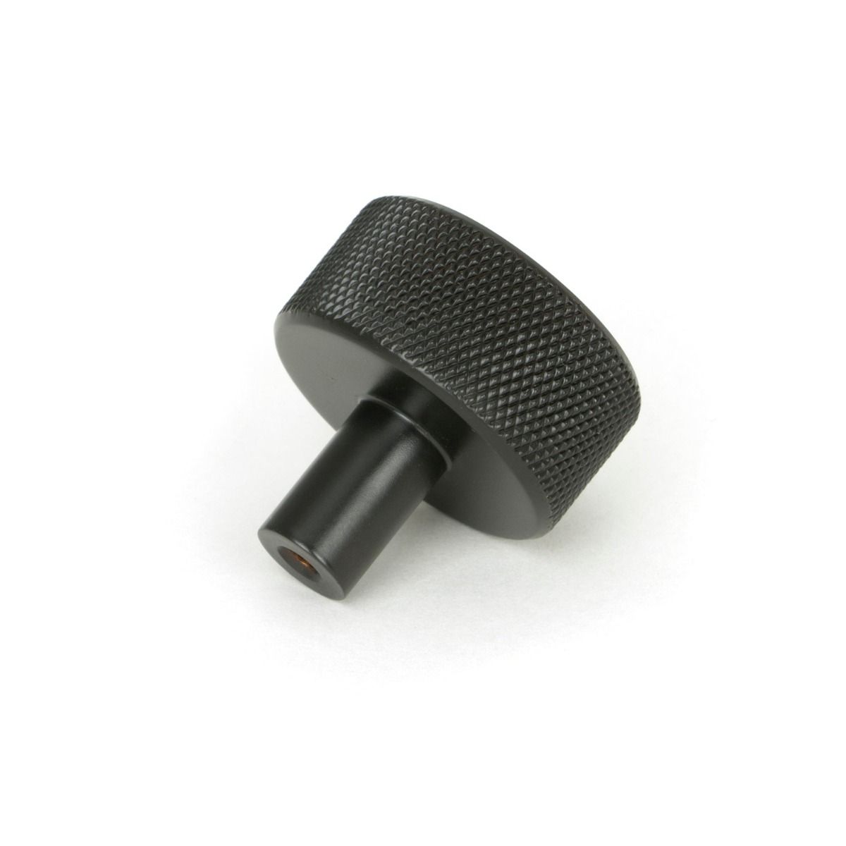The 32mm Knurled Cabinet Knob (No Rose) in Aged Bronze Shown from Behind on a White Background