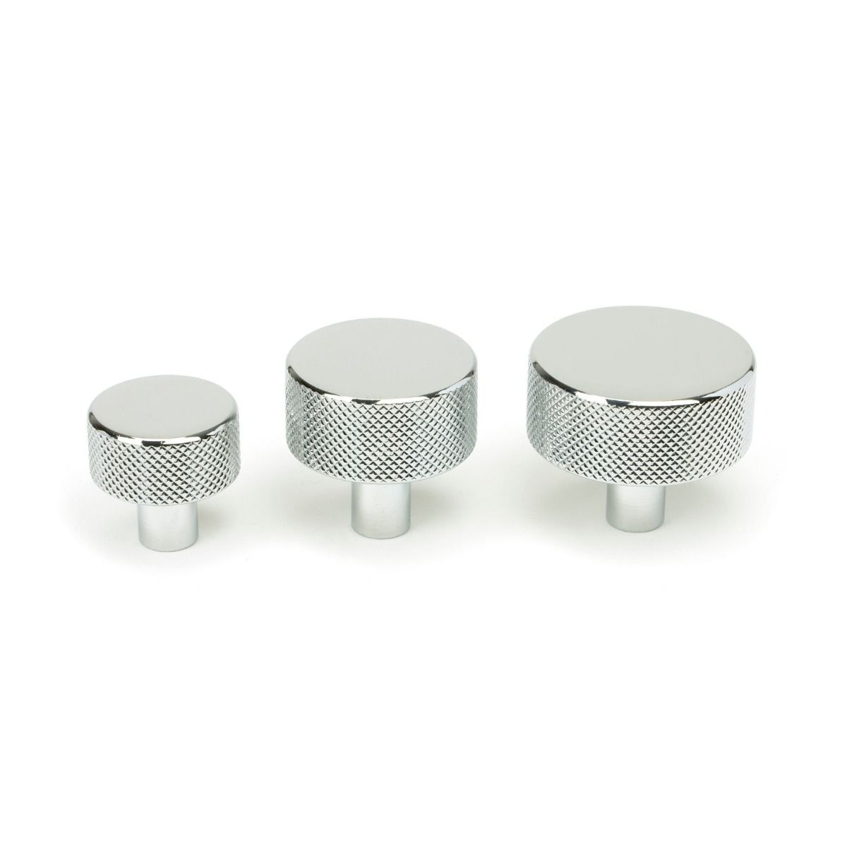 The 32mm Knurled Cabinet Knob (No Rose) in Polished Chrome Alongside Different Sizes on a White Background