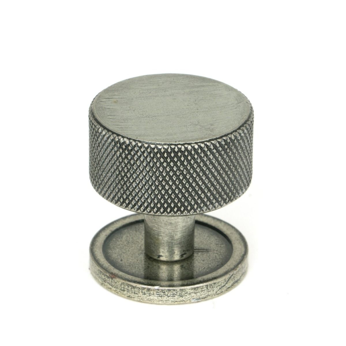 The 32mm Knurled Cabinet Knob on a Plain Rose in Pewter Shown Upright on a White Background