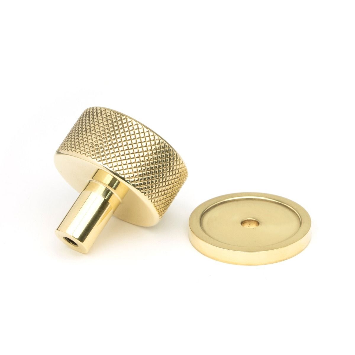 The 32mm Knurled Cabinet Knob on a Plain Rose in Polished Brass no on a White Background 
