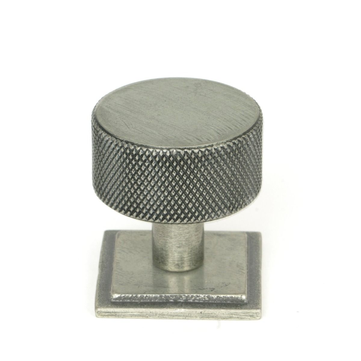 The 32mm Knurled Cabinet Knob on a Square Rose in Pewter Shown Upright on a White Background