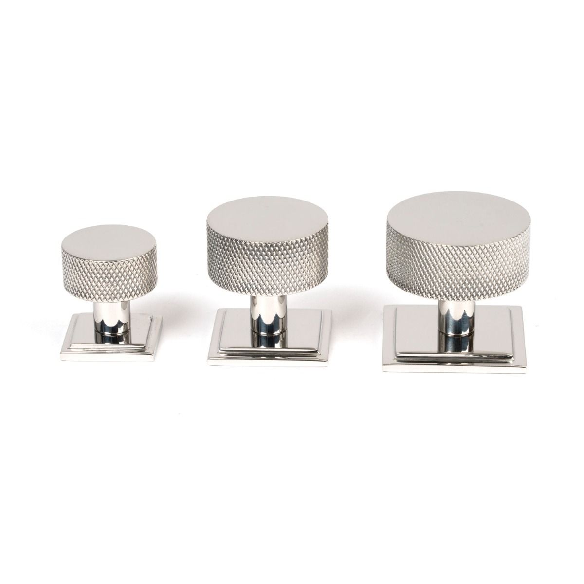 The 32mm Knurled Cabinet Knob on a Square Rose in Polished Stainless Steel Alongside Different Sizes