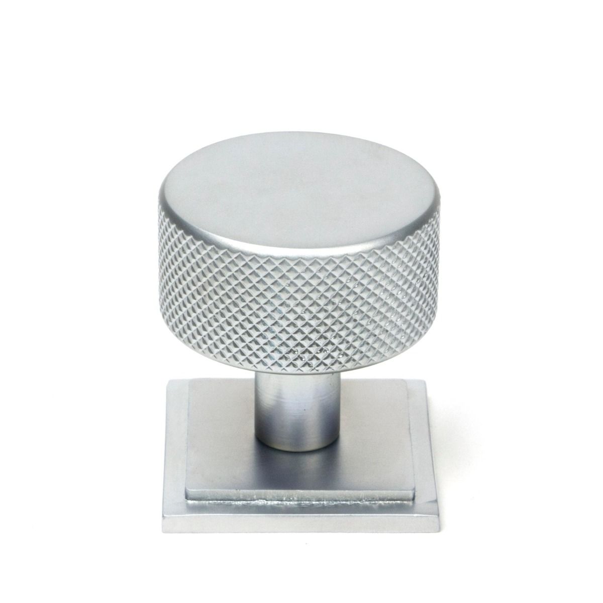 The 32mm Knurled Cabinet Knob on a Square Rose in Satin Chrome Shown Upright on a White Background