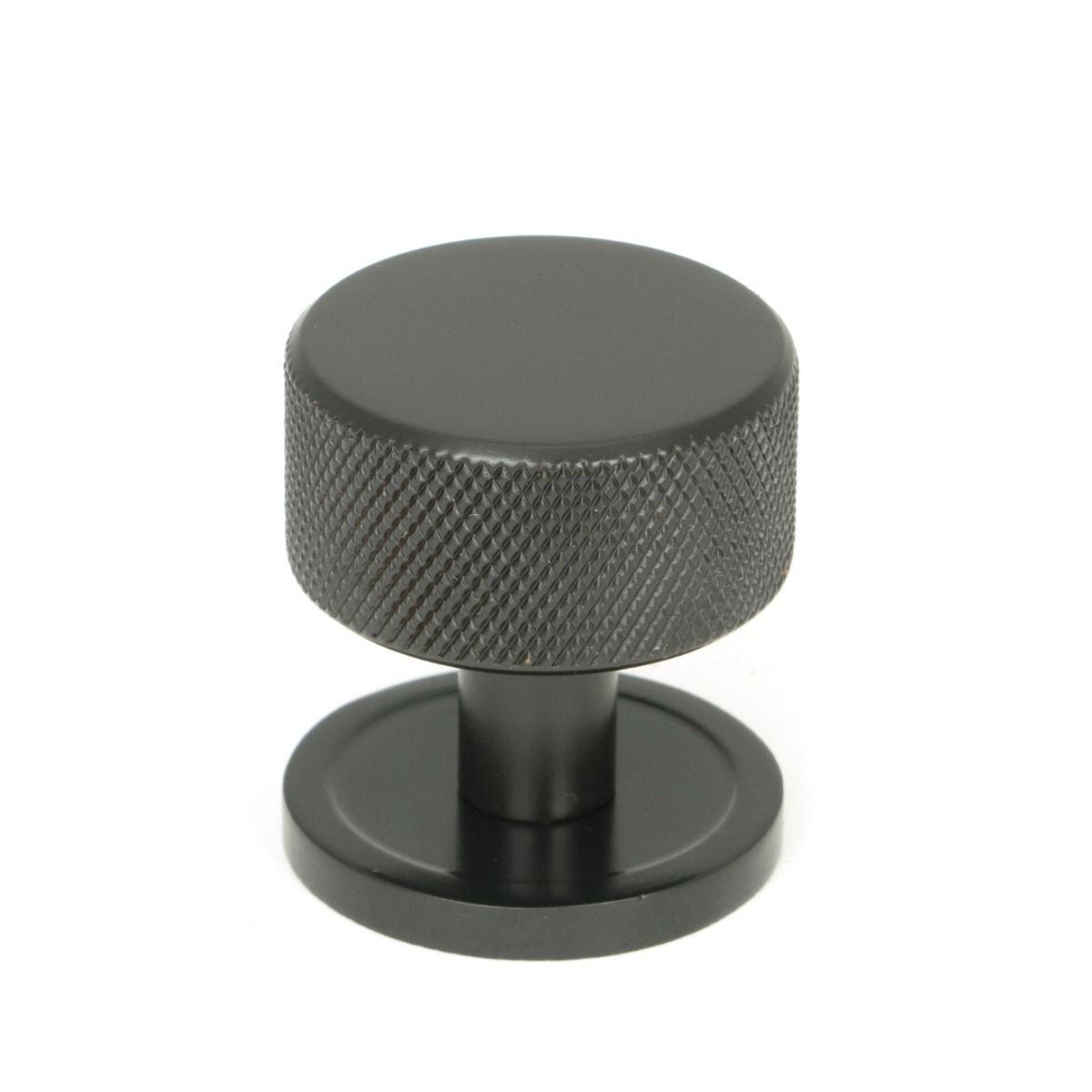 The 32mm Knurled Cabinet Knob on Plain Rose in Aged Bronze Shown Upright on a White Background