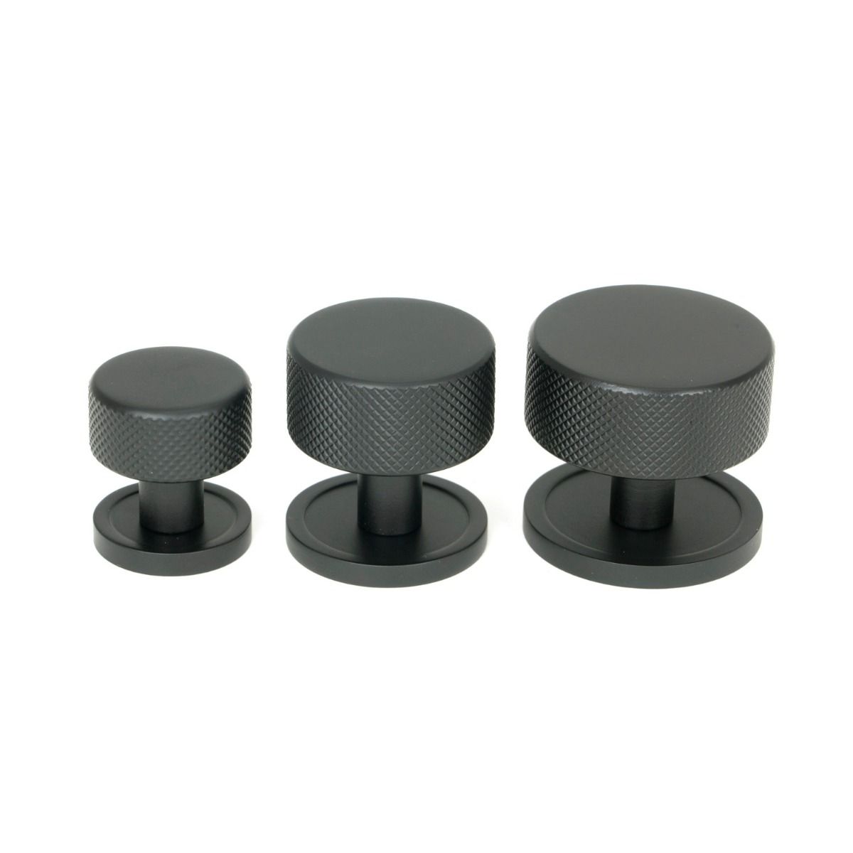 The 32mm Knurled Cabinet Knob on Plain Rose in Matt Black Alongside Different Sizes