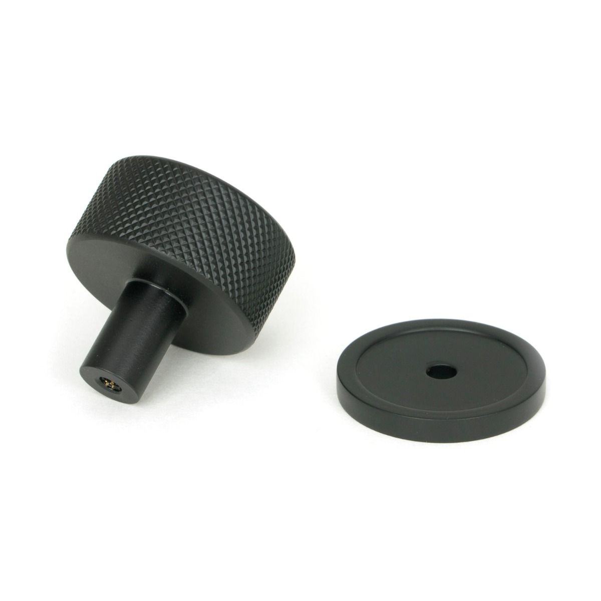 The 32mm Knurled Cabinet Knob on Plain Rose in Matt Black Shown from Behind on a White Background