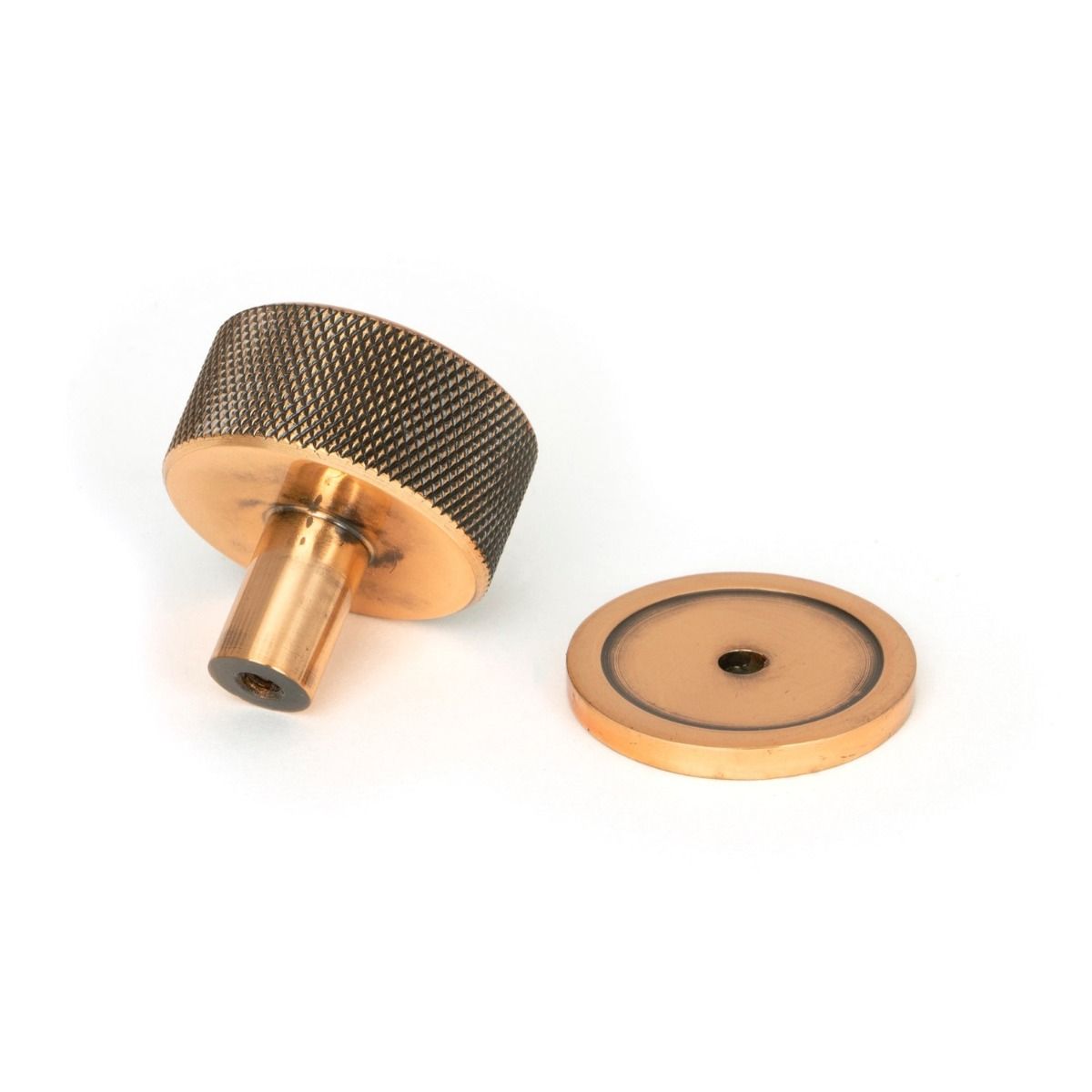 The 32mm Knurled Cabinet Knob on Plain Rose in Polished Bronze Shown from Behind on a White Background