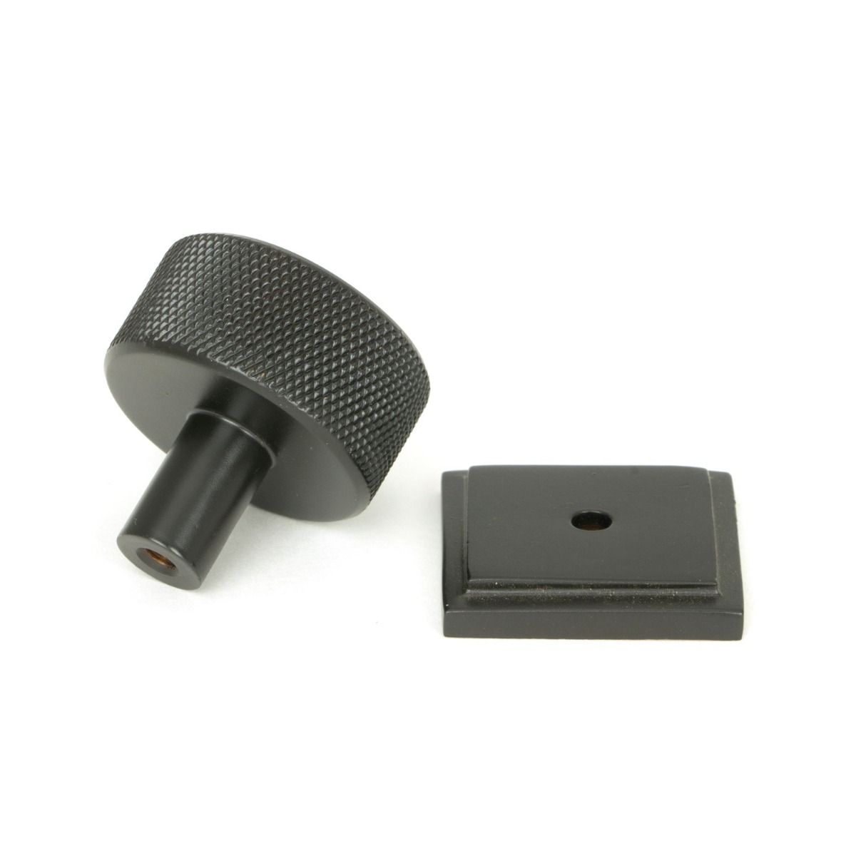 The 32mm Knurled Cabinet Knob on Square Rose in Aged Bronze Shown from Behind on a White Background