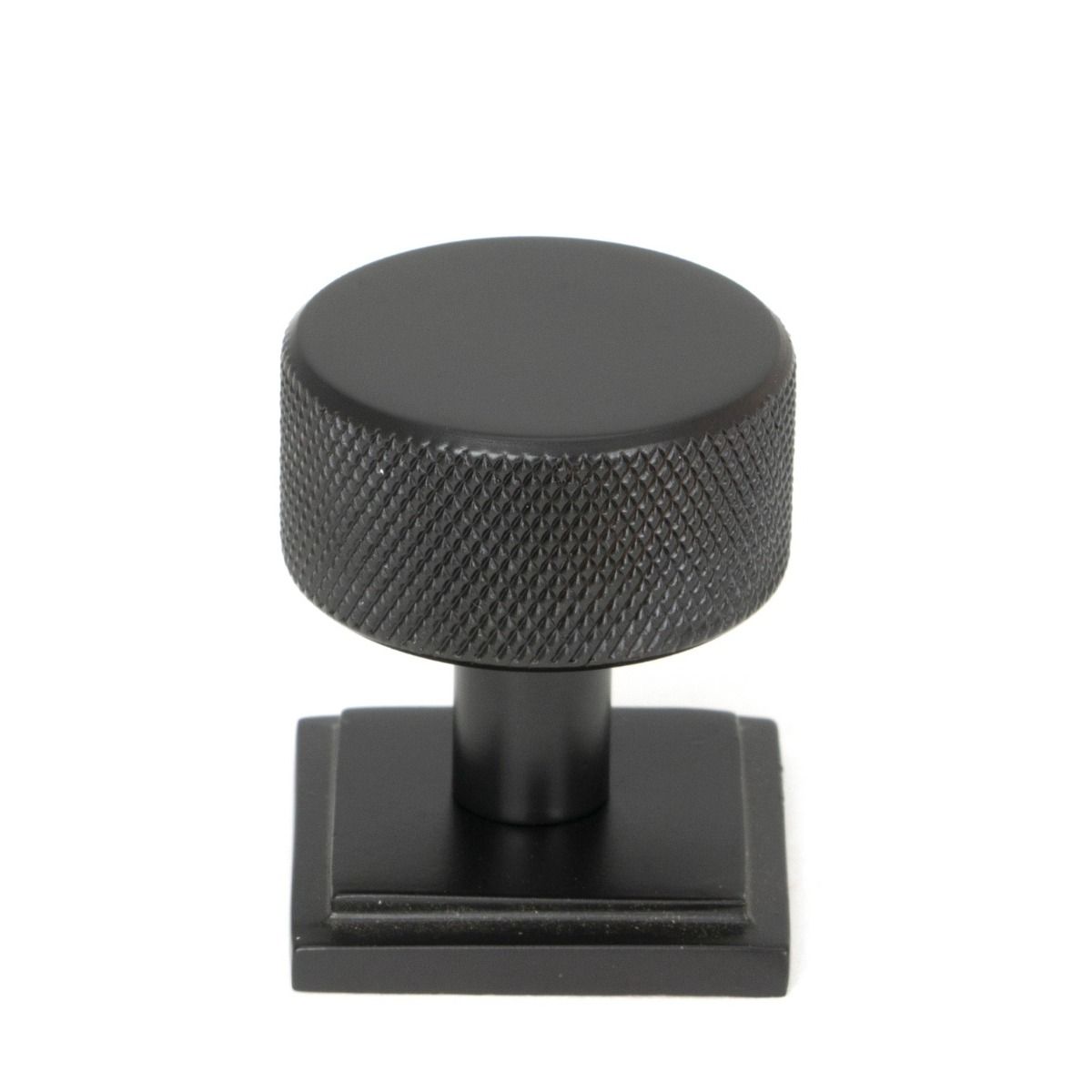 The 32mm Knurled Cabinet Knob on Square Rose in Aged Bronze Shown Upright on a White Background