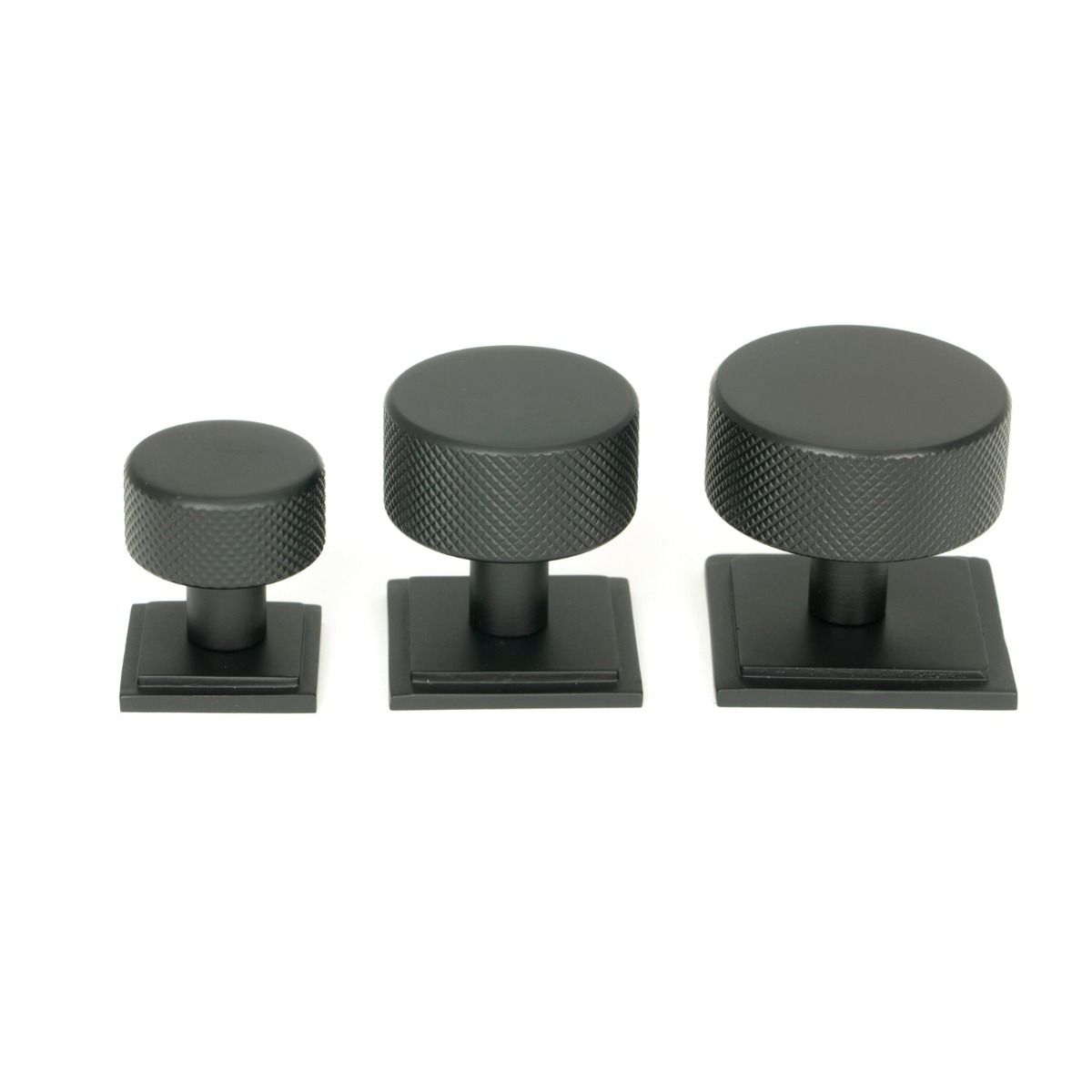The 32mm Knurled Cabinet Knob on Square Rose in Matt Black Alongside Different Sizes