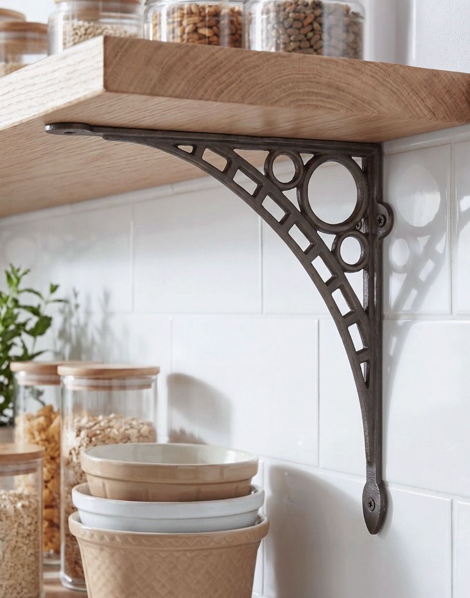 The 33 x 33cm "Ironbridge" Antique Nickel Shelf Bracket Mounted on a White Tiled Kitchen Wall in a Modern Home - Digital Illustration 
