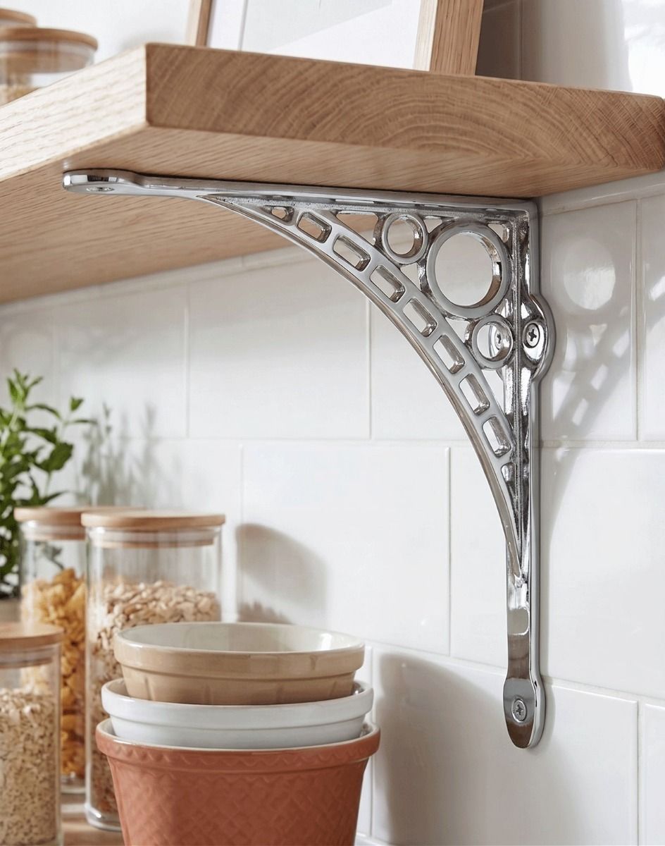 The 33 x 33cm Large Bright Chrome "Iron Bridge" Shelf Bracket Mounted on a White Tiled Kitchen Wall in a Modern Home - Digital Illustration 