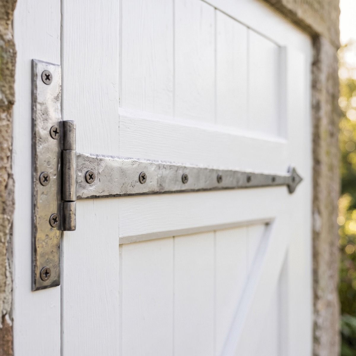 The 36" Pewter Hook & Band Tee Hinge on a White Wooden External Garage Door - Digital Illustration