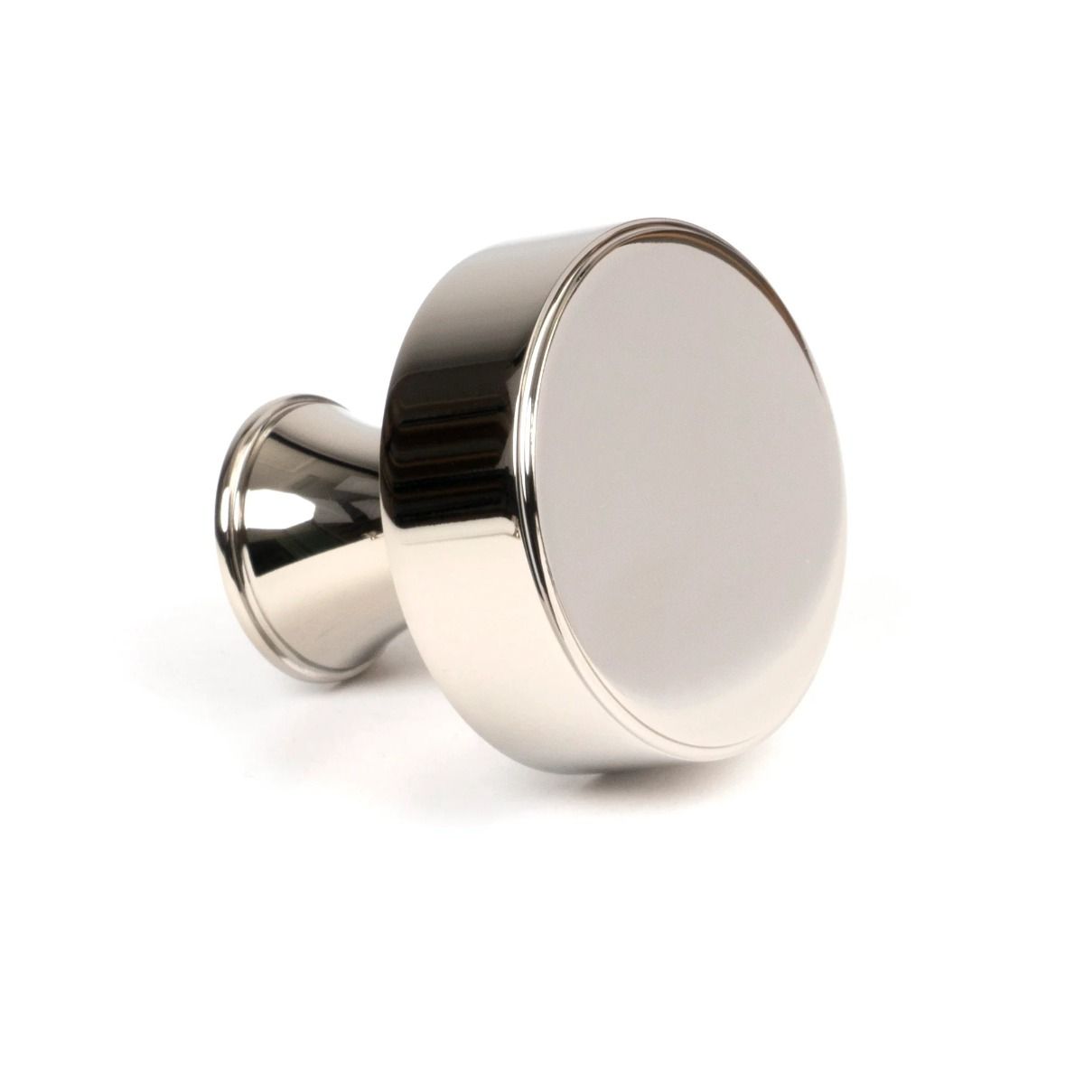 The 38mm "Atelier" Circular Cabinet Knob in Polished Nickel on a White Background Shown Side on