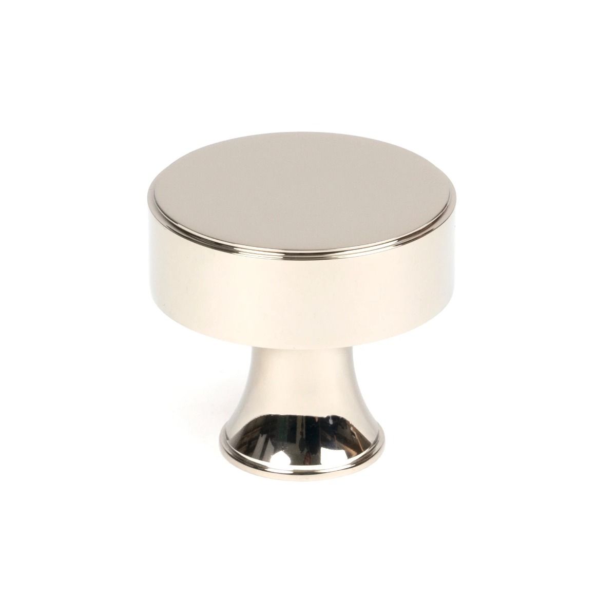The 38mm "Atelier" Circular Cabinet Knob in Polished Nickel on a White Background Stood Upright