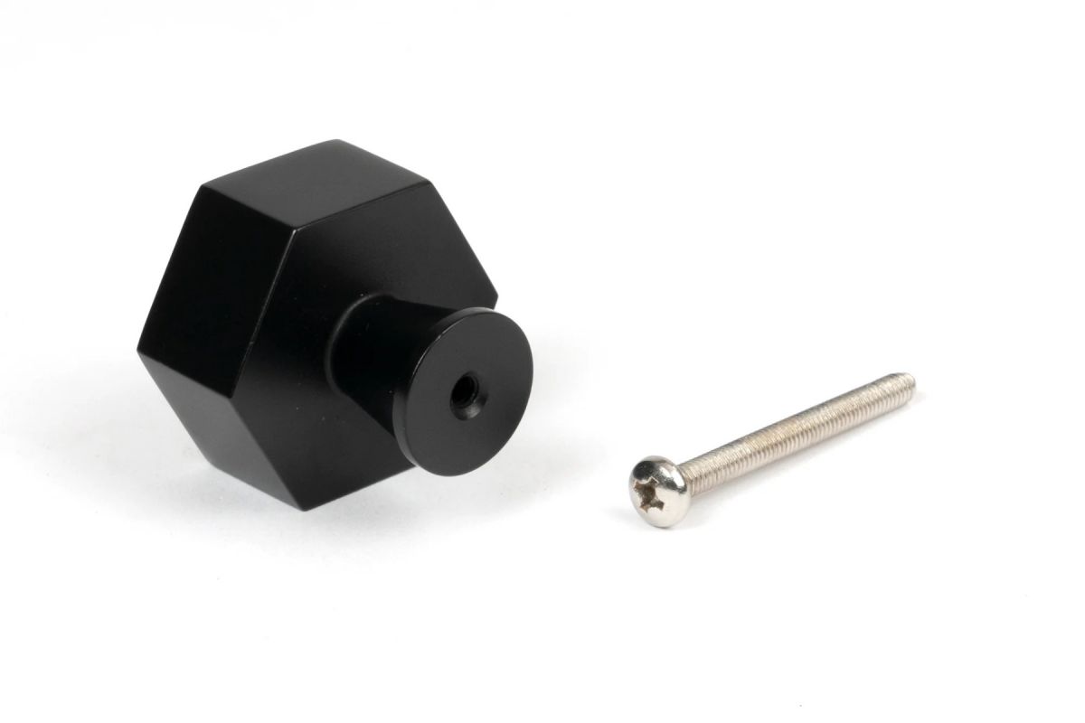 The 38mm "Vanguard" Hexagonal Cabinet Knob in Matt Black on a White Background Shown from Behind with the Screw