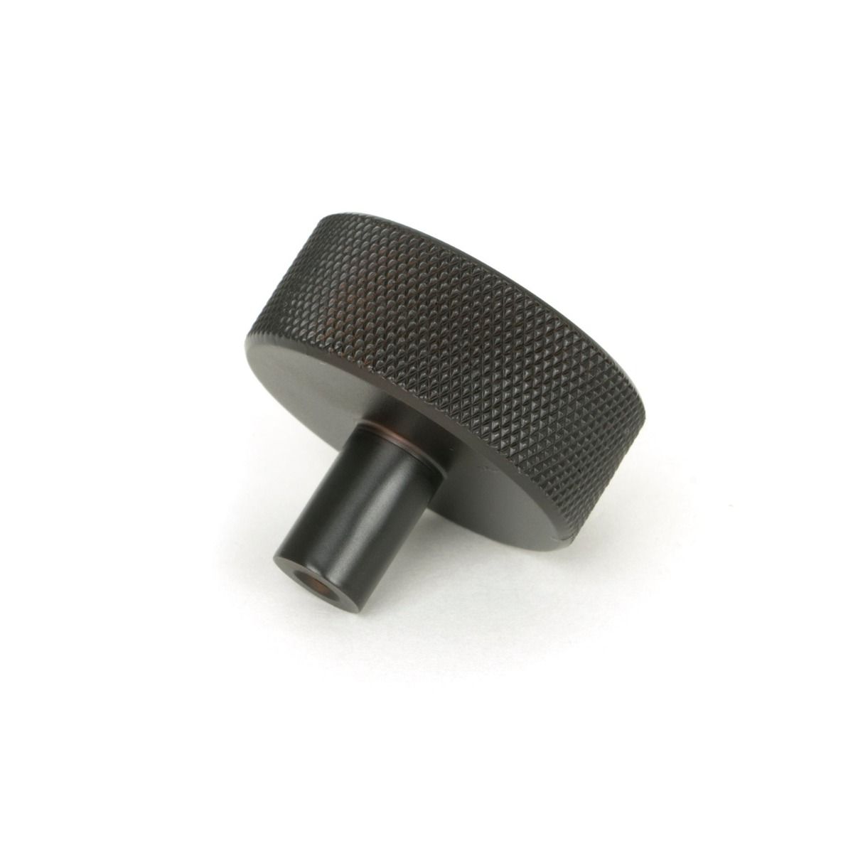 The 38mm Knurled Cabinet Knob (No Rose) in Aged Bronze Shown from Behind on a White Background