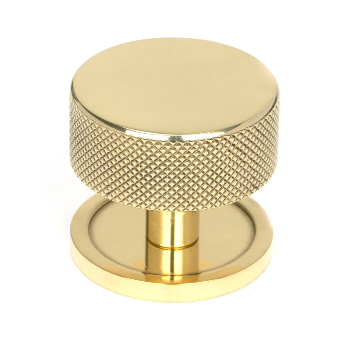 The 38mm Knurled Cabinet Knob on a Plain Rose in Polished Brass Shown Upright on a White Background 