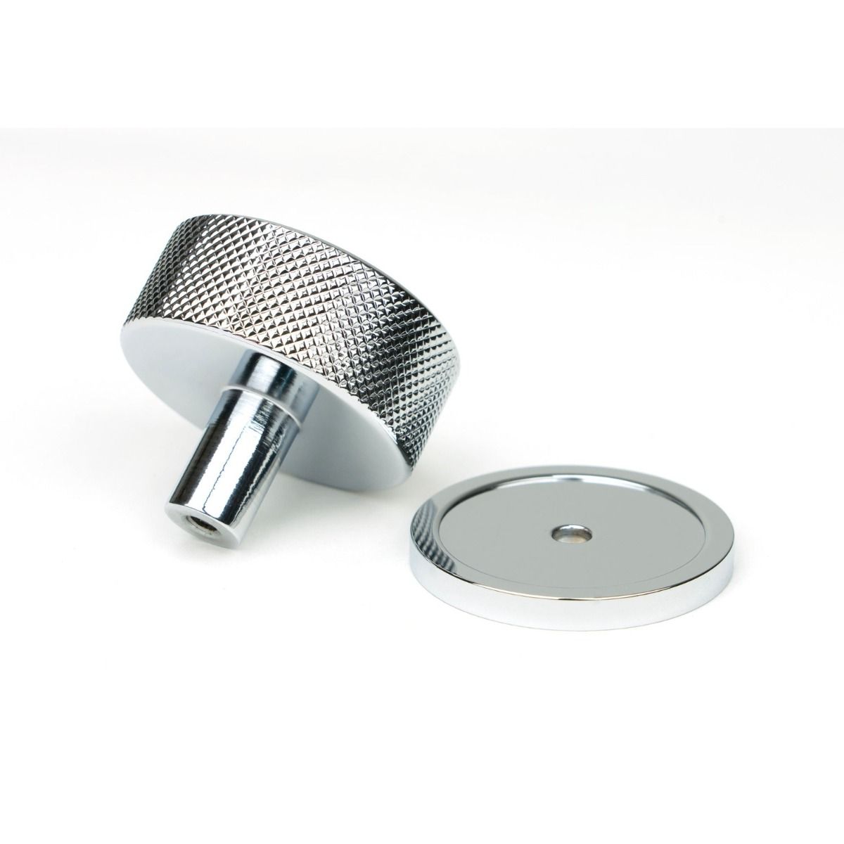 The 38mm Knurled Cabinet Knob on a Plain Rose in Polished Chrome Shown from Behind on a White Background