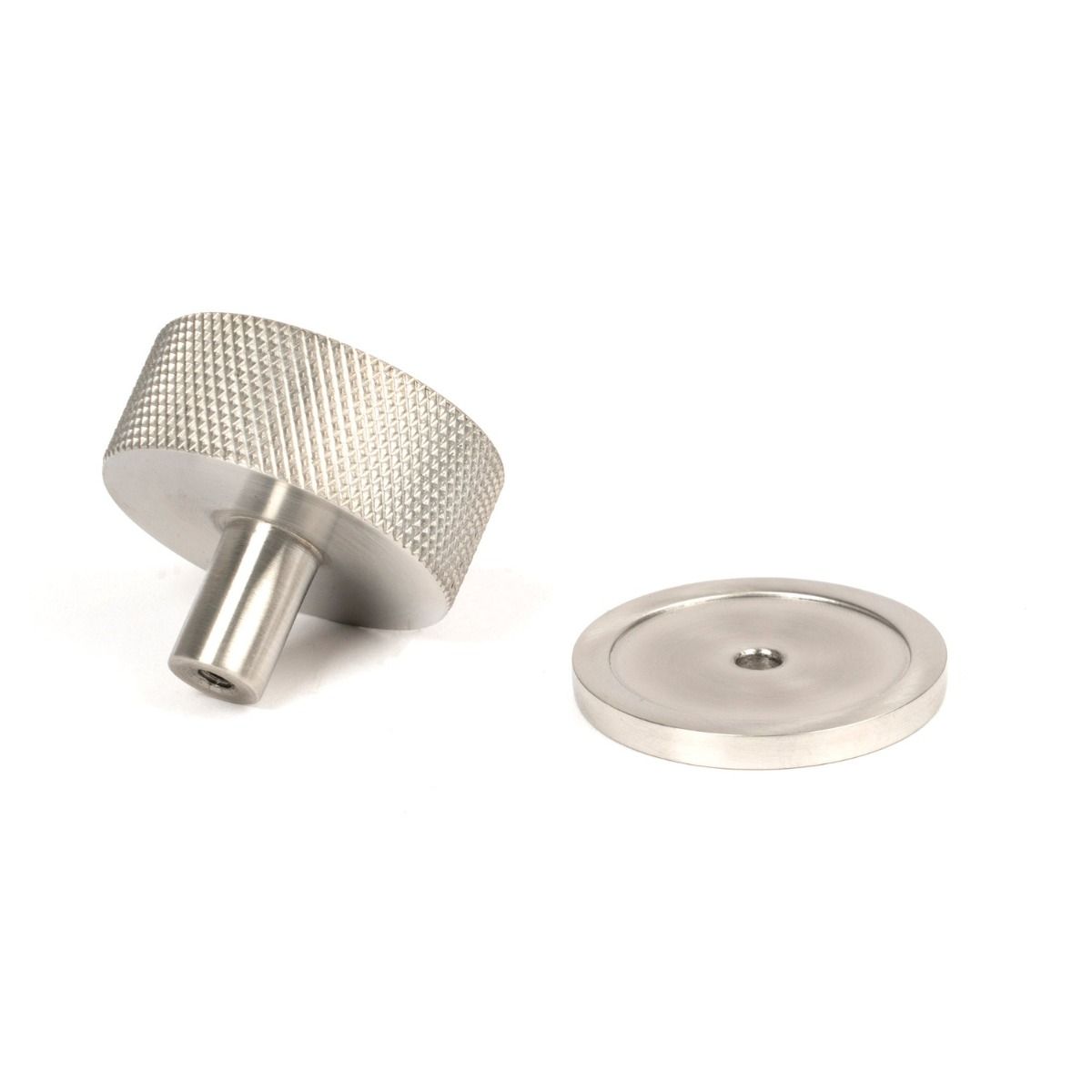 The 38mm Knurled Cabinet Knob on a Plain Rose in Satin Stainless Steel Shown from Behind on a White Background