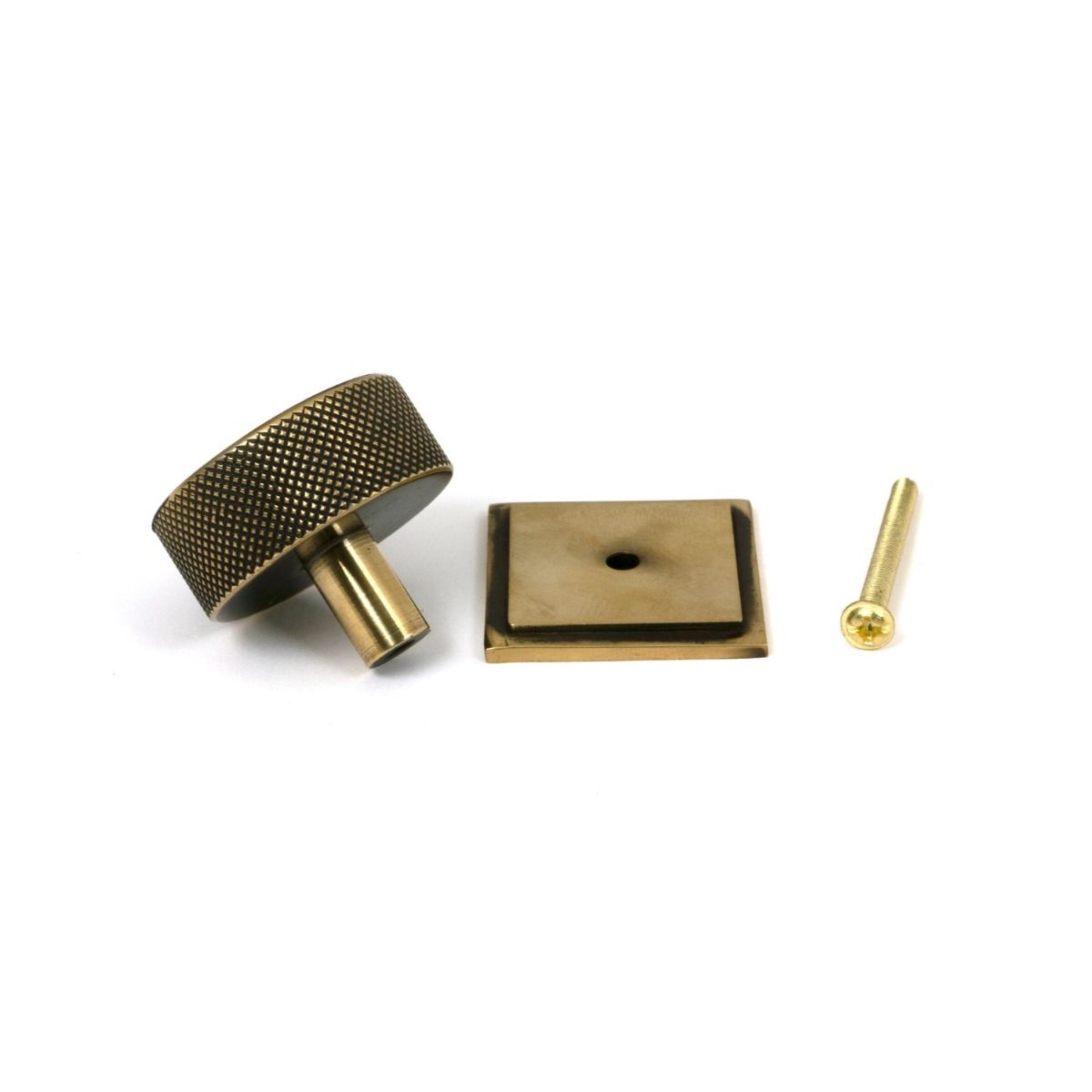 The 38mm Knurled Cabinet Knob on a Square Rose in Aged Brass Showing the Separate Components and Supplied Fitting