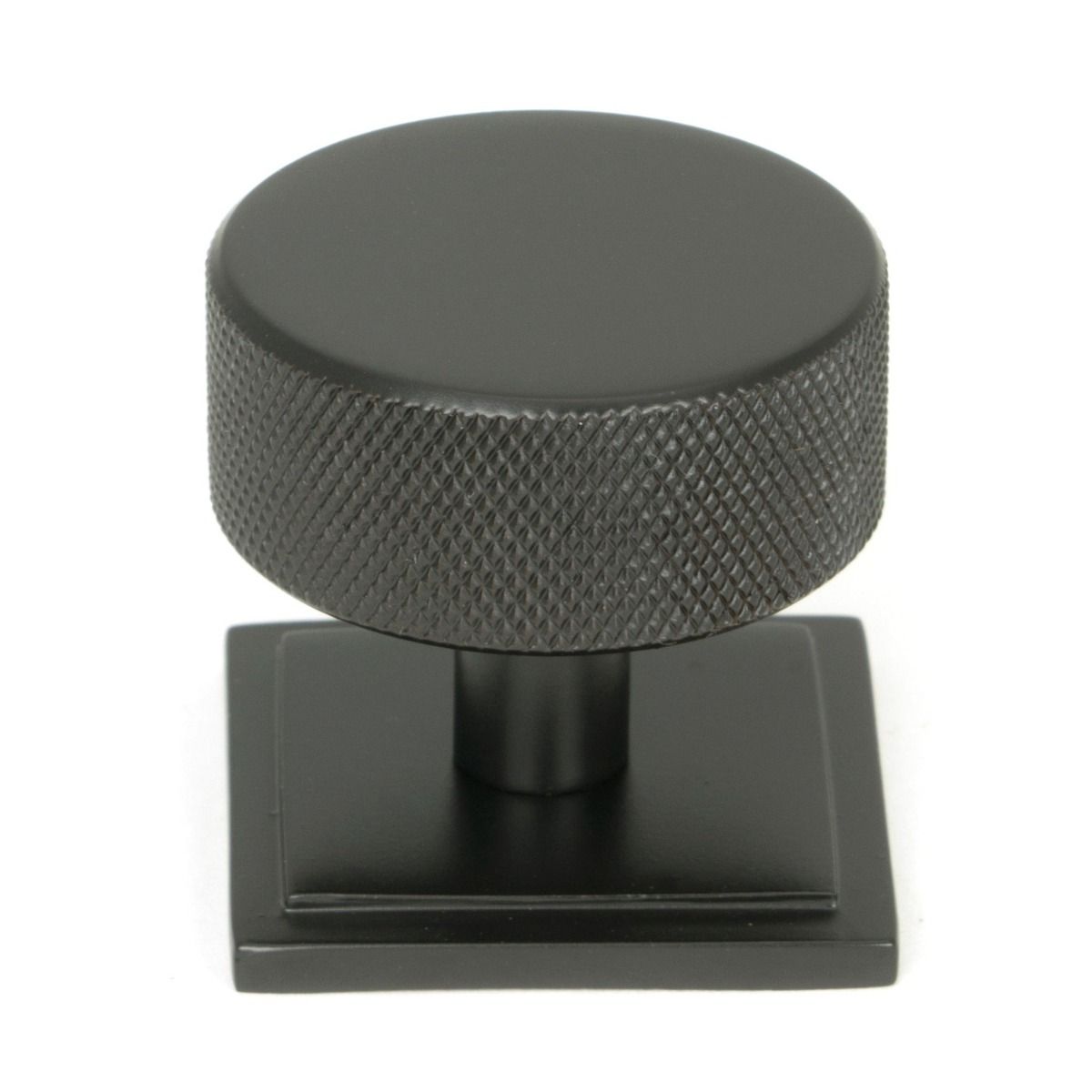 The 38mm Knurled Cabinet Knob on a Square Rose in Aged Bronze Shown Upright on a White Background