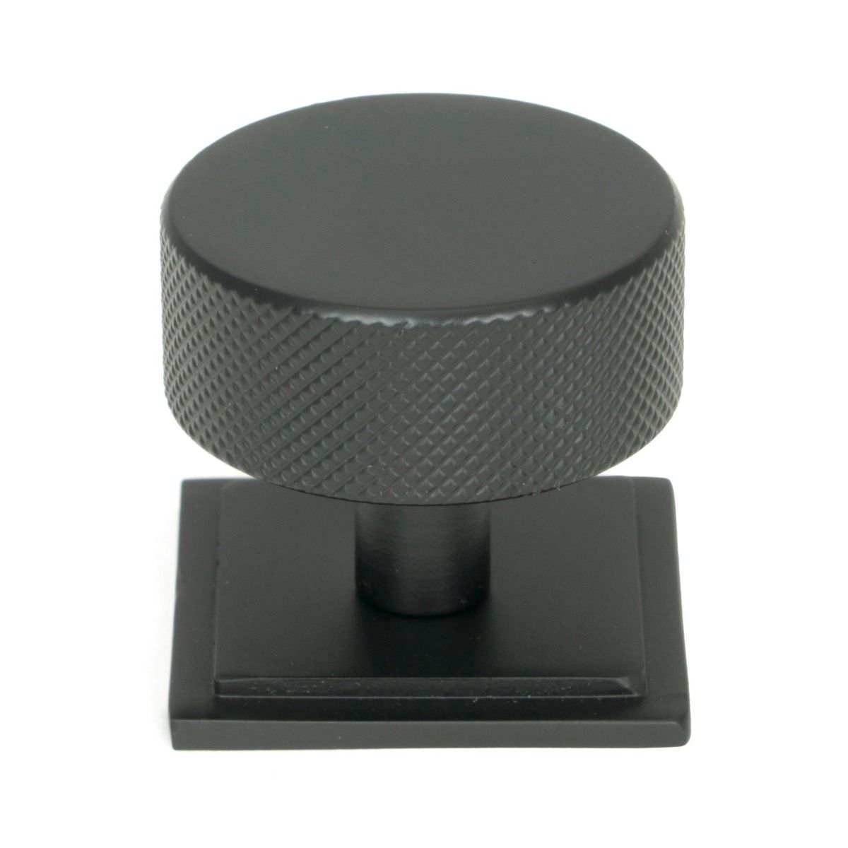 The 38mm Knurled Cabinet Knob on a Square Rose in Matt Black Shown Upright on a White Background