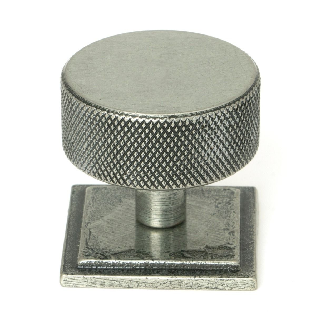 The 38mm Knurled Cabinet Knob on a Square Rose in Pewter Shown Upright on a White Background