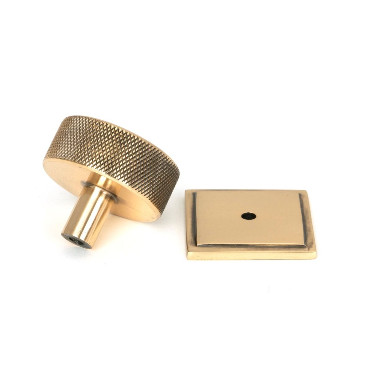 The 38mm Knurled Cabinet Knob on a Square Rose in Polished Bronze Shown from Behind on a White Background