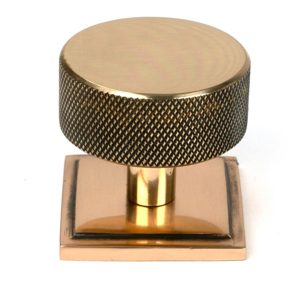 The 38mm Knurled Cabinet Knob on a Square Rose in Polished Bronze Shown Upright on a White Background