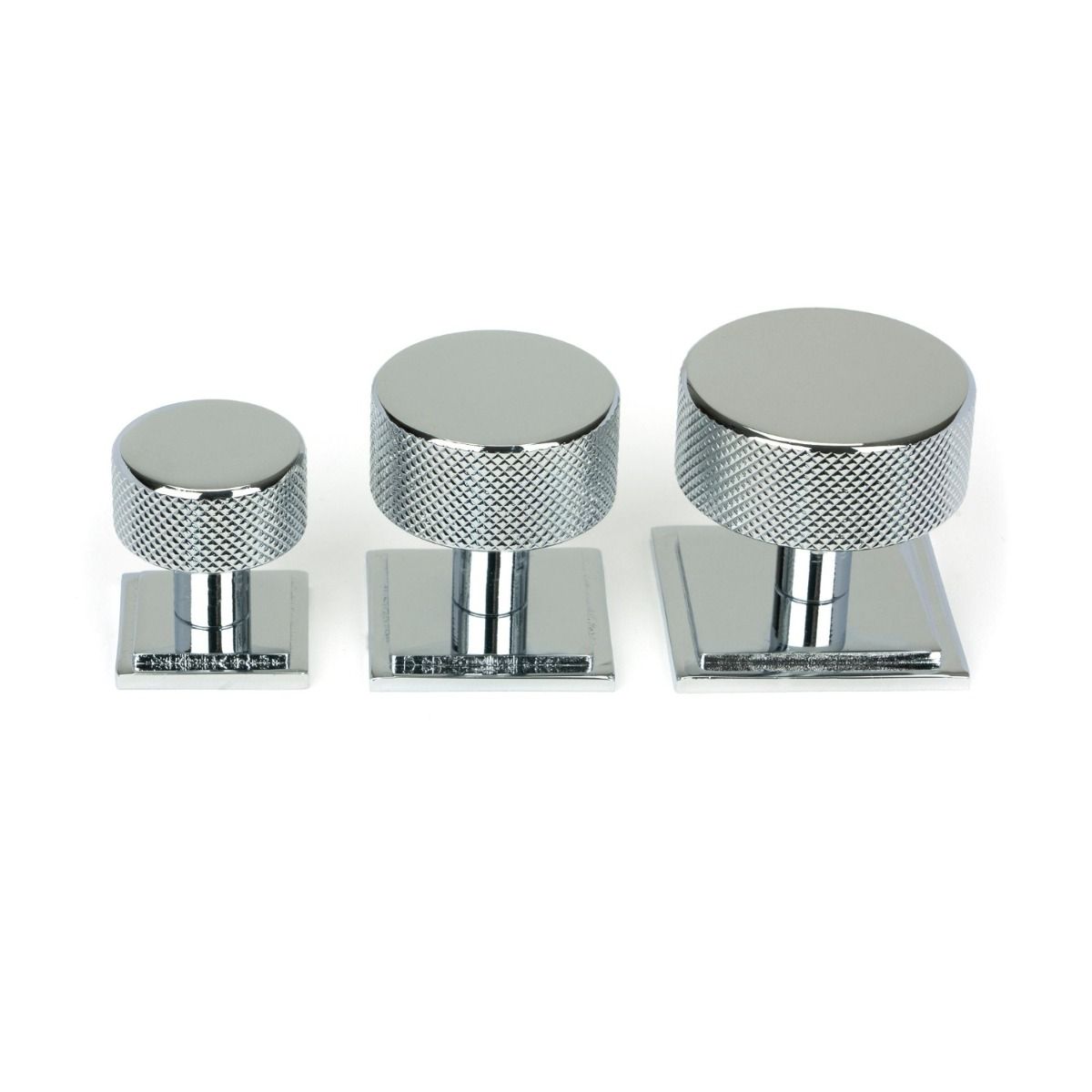 The 38mm Knurled Cabinet Knob on a Square Rose in Polished Chrome Next to Other Available Sizes on a White Background