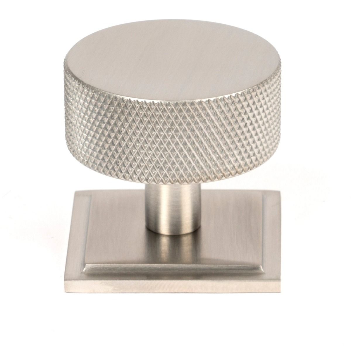 The 38mm Knurled Cabinet Knob on a Square Rose in Satin Stainless Steel Shown Upright on a White Background