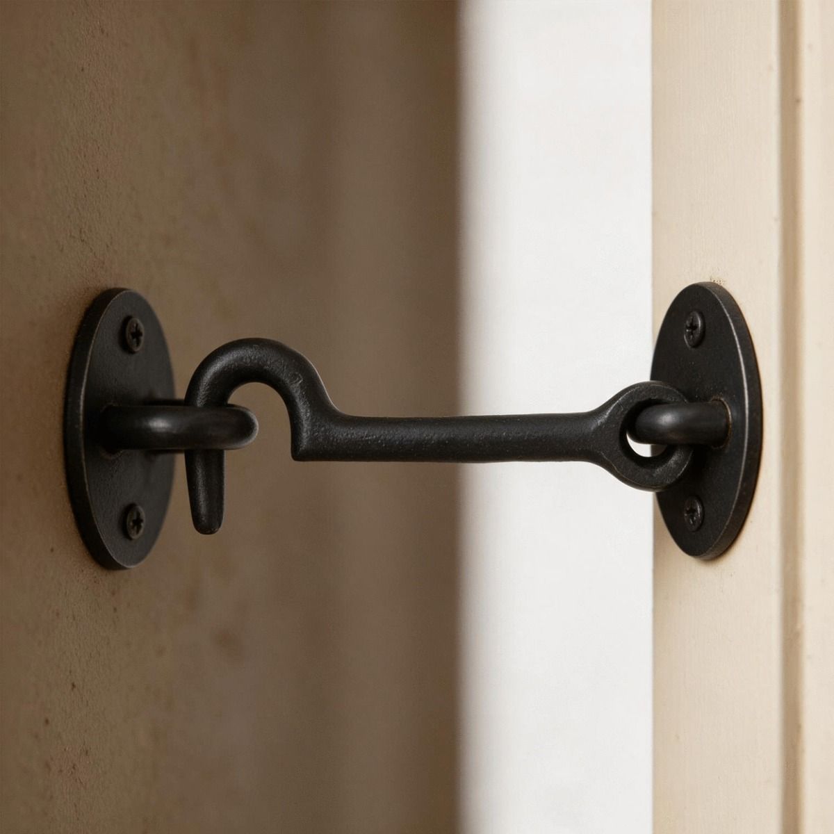 The 3" Simplistic Iron Cabin Hook Shown Fitted on a Cream Coloured Door - Digital Illustration  