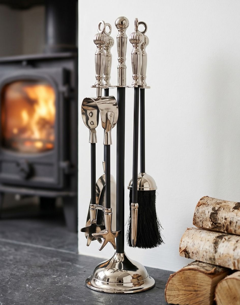 The 40cm Tudor Fireside Companion Set - Nickel & Black Iron Next to a White Fireplace in a Modern Home Interior - Digital Illustration
