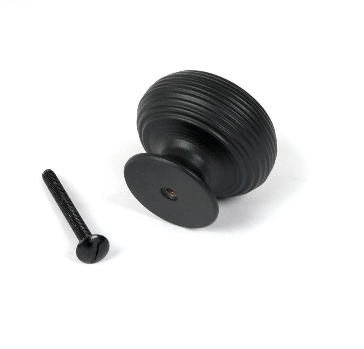 The 40mm "Garrison" Ribbed Beehive Knob in Matt Black on a White Background Shown from Behind with the Screw