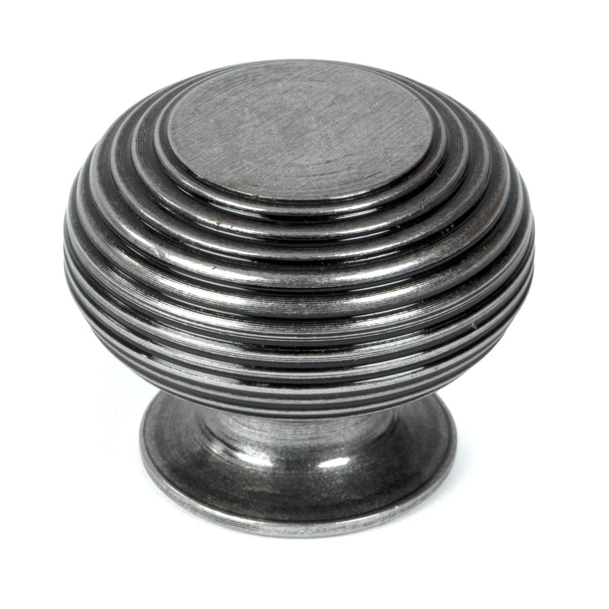 The 40mm _Garrison_ Ribbed Beehive Knob in Pewter on a White Background Stood Upright 