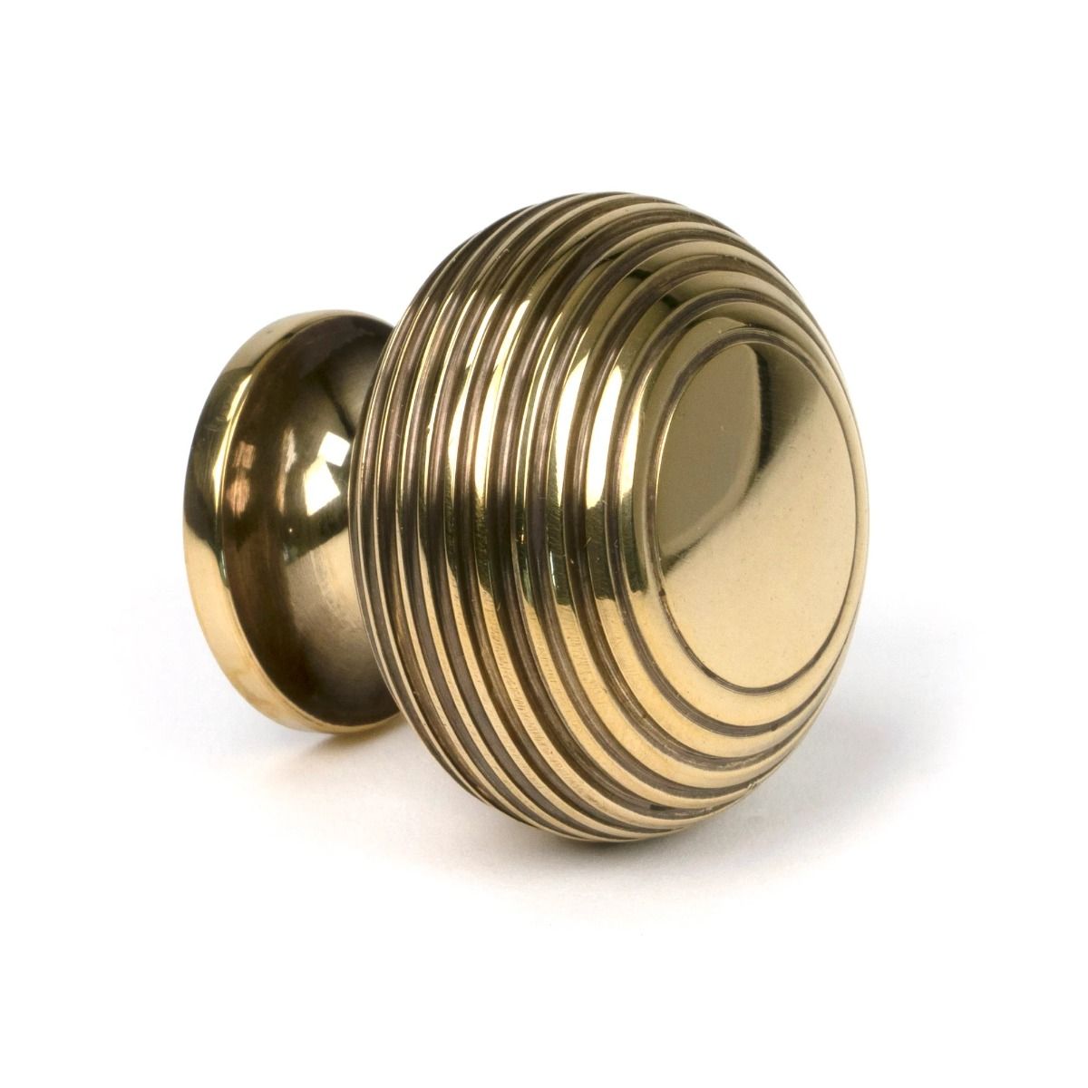 The 40mm Individual Aged Brass Beehive Cabinet Knob on a White Background Shown from the Side