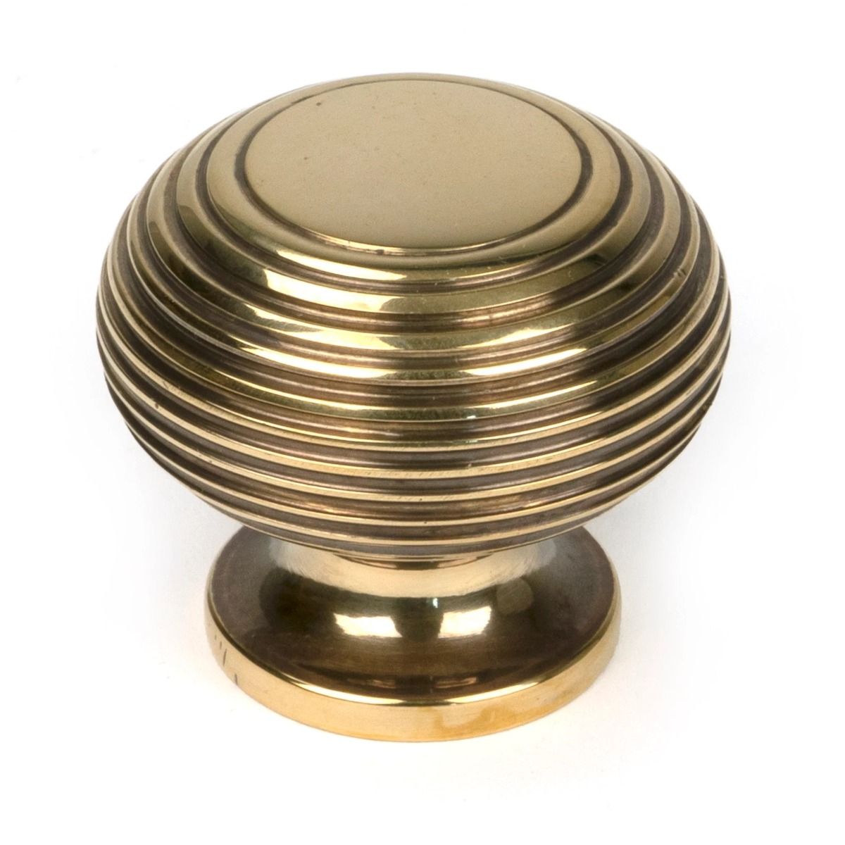 The 40mm Individual Aged Brass Beehive Cabinet Knob on a White Background Shown Upright