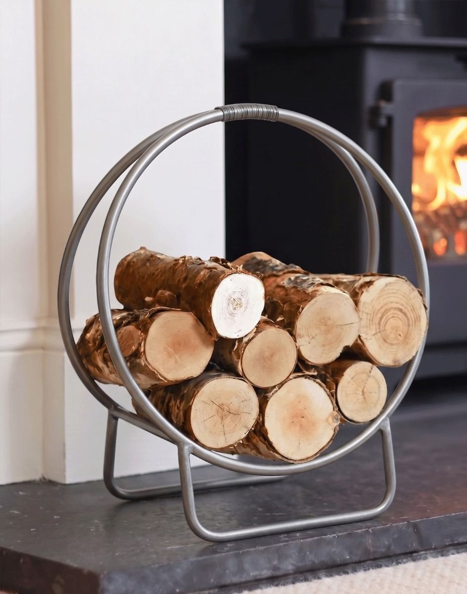 The 45cm Pewter Finish Contemporary Circular Log Rack & Holder on a Black Stone Hearth in a Modern Home - Digital Illustration