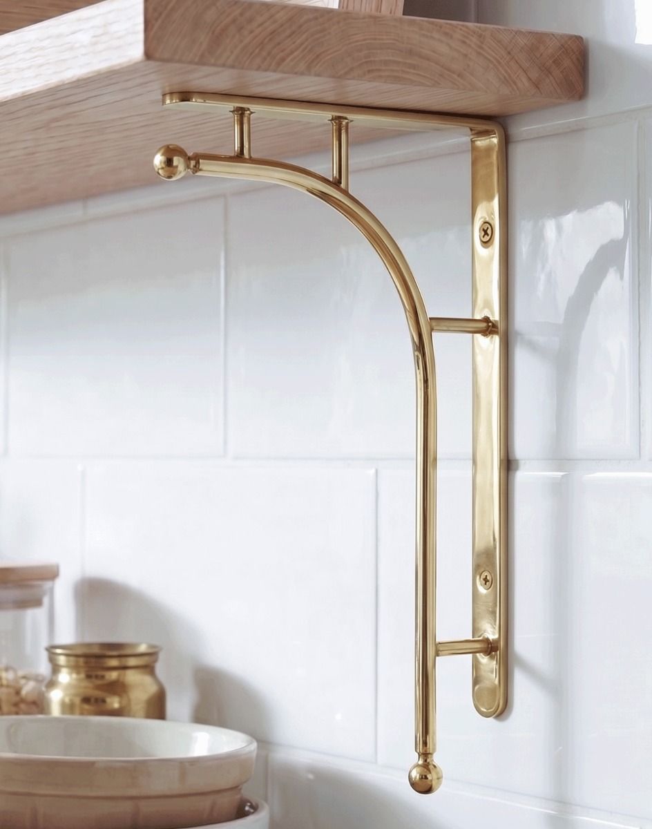 The 50 x 24cm Kepler Modern Polished Brass Bracket Mounted in a Modern Kitchen on a white Tiled wall - Digital Illustration 