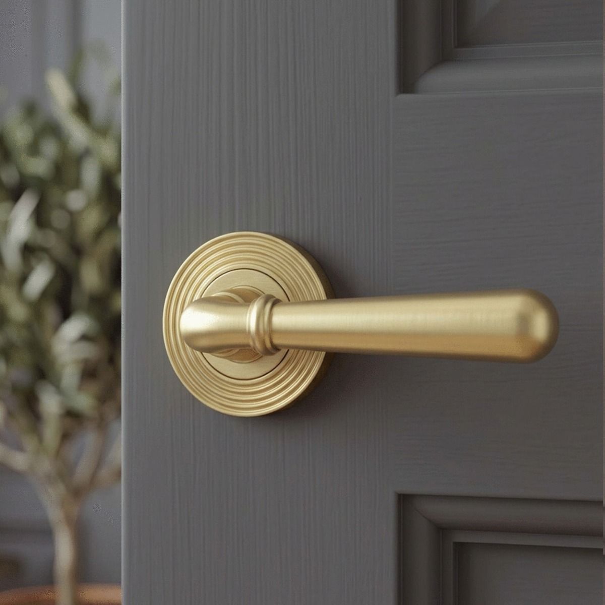 The 53mm Modern Satin Brass "Neville" Unsprung Beehive Door Handle on Rose Set on a Dark Grey Door in a Modern Interior Setting - Digital Illustration