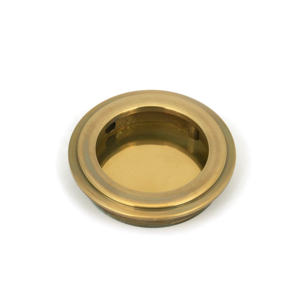 The 60mm Art Deco Round Flush Pull Handle in Aged Brass Shown from the Front on a White Background