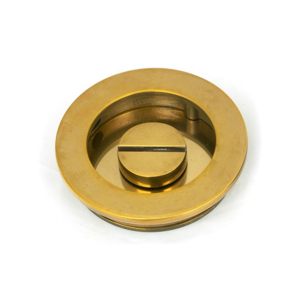 The 60mm Classic Round Sliding Pocket Door Privacy Set in Aged Brass Showing the Coin Release Side