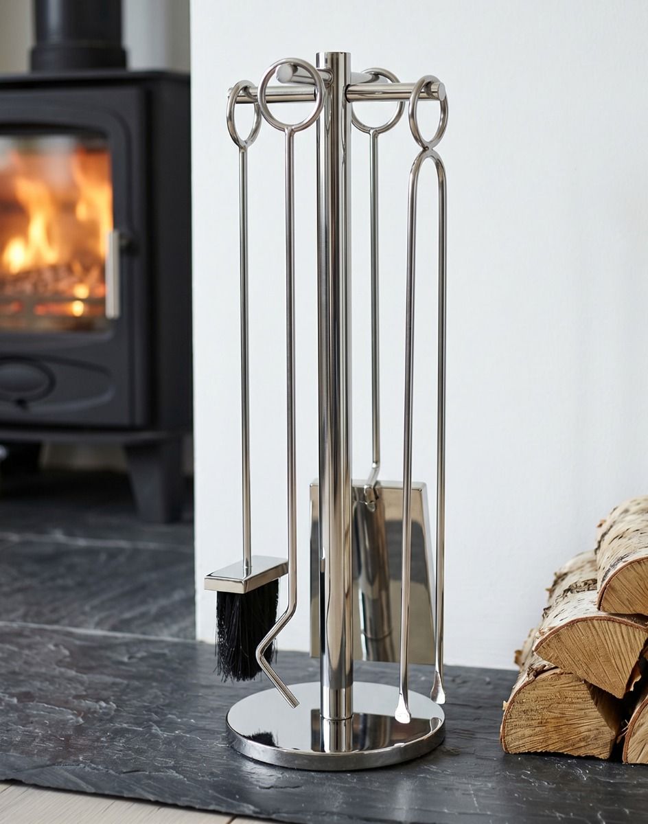 The 62cm “Westgate Park” Polished Chrome Companion Set next to a Contemporary Fireplace with Log Burner Stove - Digital Illustration 