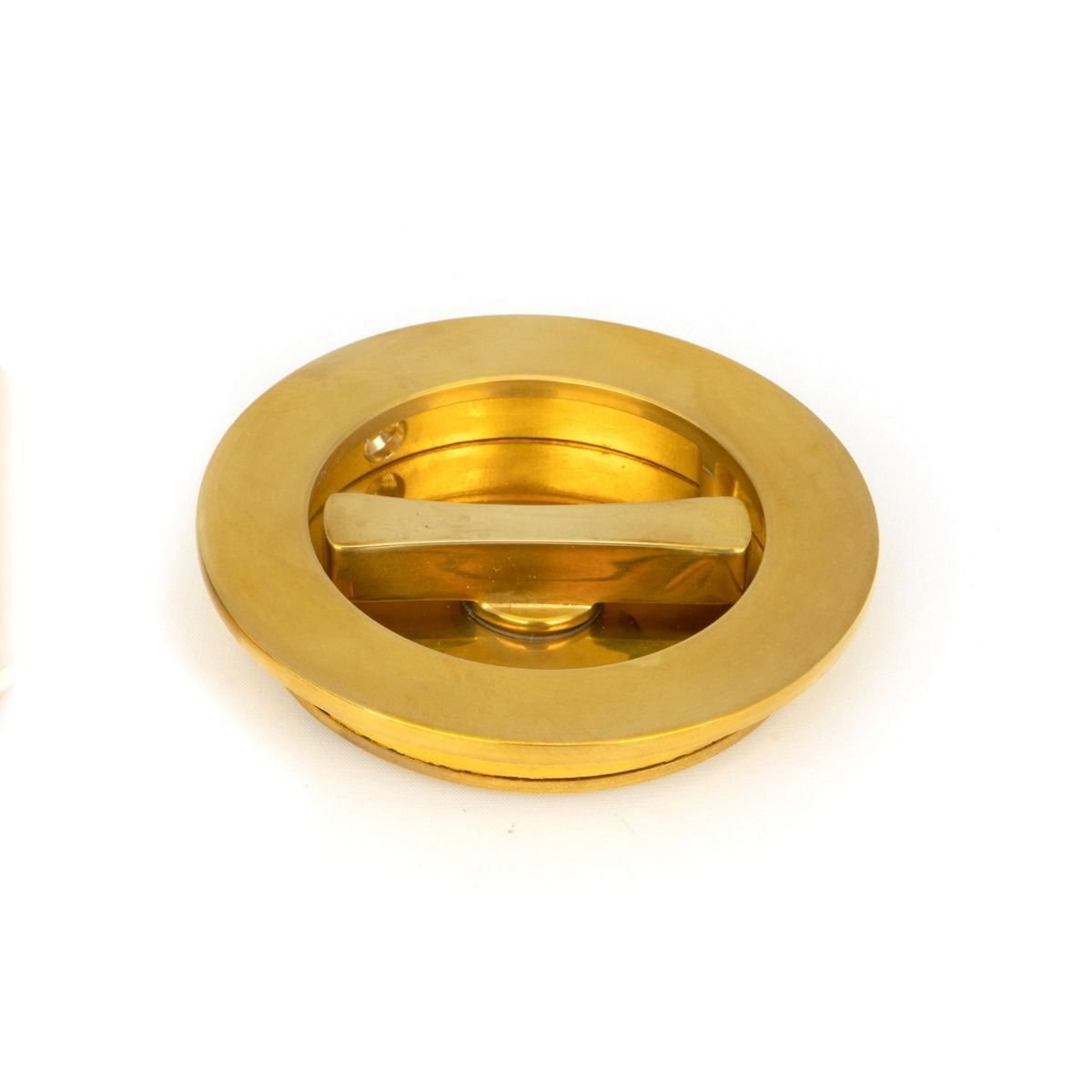 The 75mm Classic Round Sliding Pocket Door Privacy Set in Polished Brass Showing a Close up of the Thumbturn