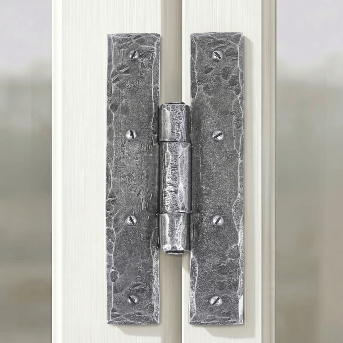 The 7" Pewter H Hinge Pair Fixed onto a White Wooden Window Frame in a Modern Home - Digital Illustration